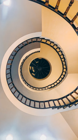 Spiral staircase in a modern office building. View from aboveの写真素材
