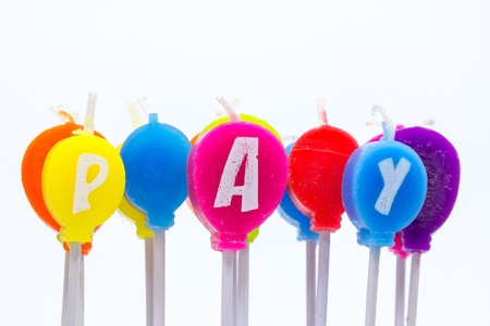 pay colourful candles on white backgroundの写真素材
