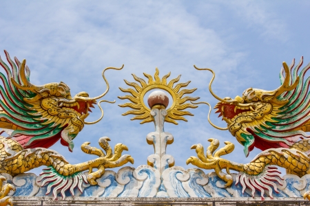 flying twin golden dragons with the ballの写真素材