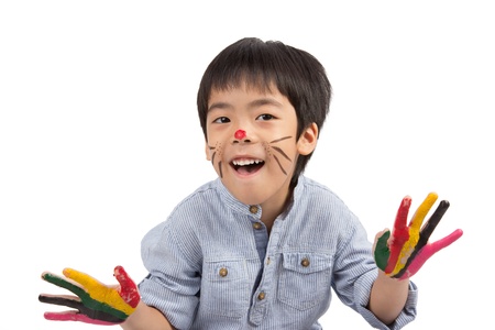 asian boy with colorful painting isolated on white backgroundの写真素材