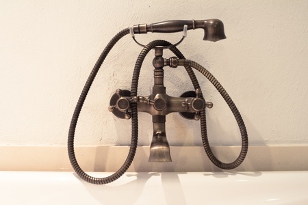 retro bronze brass douche on the wallの写真素材