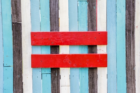 Equal sign symbol on the wooden wallの写真素材