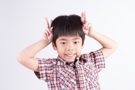 Child Making Peace Signの写真素材