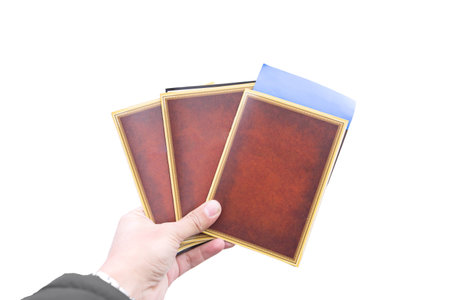 human hand holding empty books and ticket isolated 