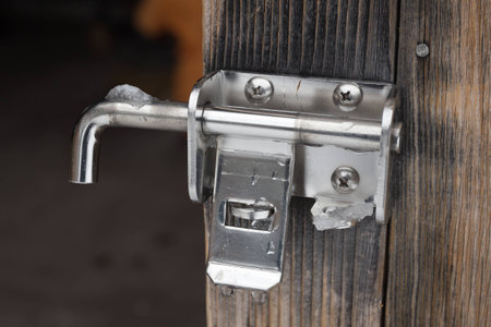 The padlock locking the wooden door