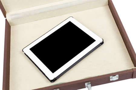 Modern white tablet pc in briefcase isolated on white