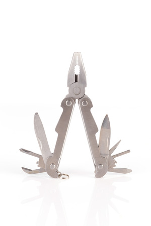 a metallic multitool isolated on white