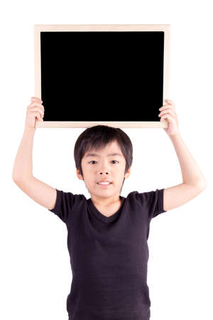 Happy boy with blackboard isolated の写真素材
