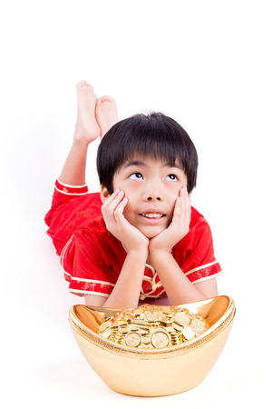 Cute Asian Boy In Tradition Chinese Cheongsam Isolated On White Background : Chinese New Year Conceptの写真素材