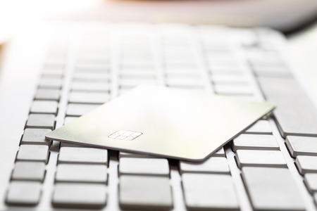 Electronic Chip on Credit card : Concept of online shopping (Selective Focus)
