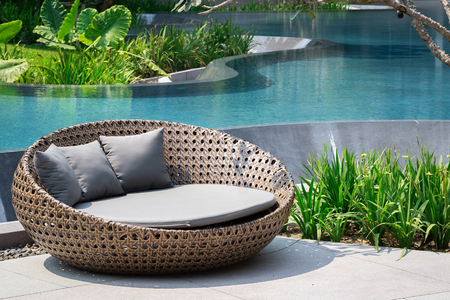 Relaxing Rattan Sofa At Swimming Poolの写真素材