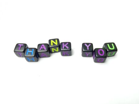 Photo Illustration, Word Thank you from black plastic alphabet cube beadsの写真素材