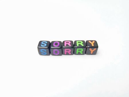 Photo Illustration, Word Sorry from black plastic alphabet cube beadsの写真素材