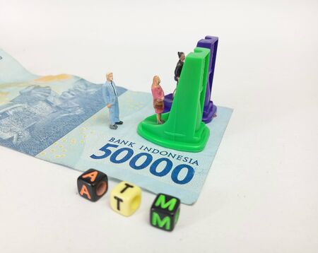 Simple Photo ilustration for Financial Transaction at Automatic Teller Machine, 50000 indonesia...