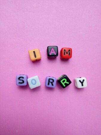 Photo Illustration, Word I am Sorry from plastic alphabet cube beadsの写真素材