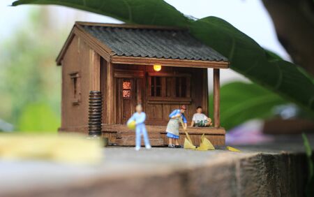 Stay Home Concept, Due the Covid-19 Pandemic Virus, Morning Activity at Village, Housewife, Sweeping Housewife, Sitting Relaxing Father at terraceの写真素材