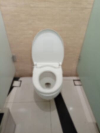 Defocus Photo White Clean Toilet at public areaの写真素材