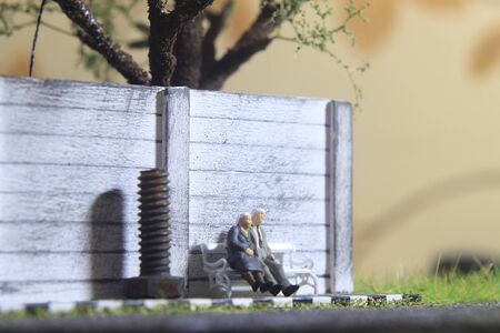 illustration photo for romantic memorable moment, Old Couple Mini figure Toy sit at white chairの写真素材