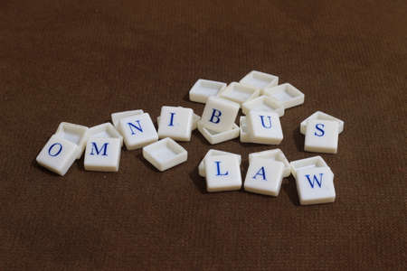 Illustration Photo for Omnibus Law, Blue Alphabet at Plastic Cube