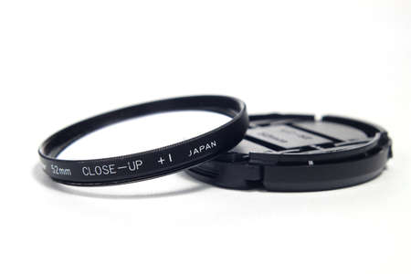 High Quality filter Close Up Lens Plus one, Made in Japan for DSLR, 52 mm diameter, at white backgroundの写真素材