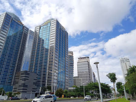 Editorial Photo, 27 November 2021, Indonesia, Mandiri Sekuritas at Central Jakarta and some people in car seenのeditorial素材