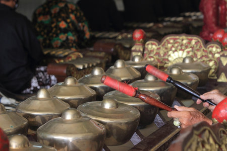 Close Up Photo Hand of Gamelan Player, Traditional Java, Indonesia Musical Instrumentの写真素材