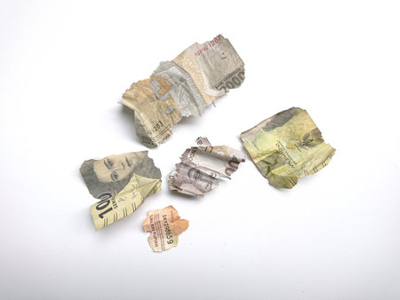 broken, torn, indonesia paper money, suitable for illustration bankrupt or loss at financial...