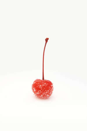 Standing red canded cocktail cherry covered in sugarの写真素材