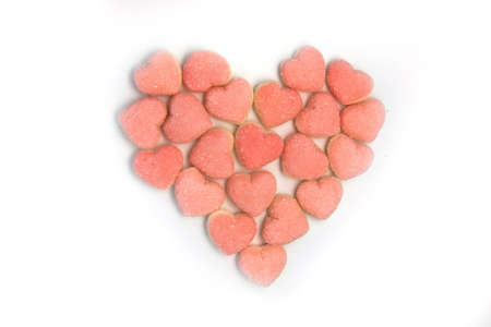Small pink jelly candies forming a shape of a heartの写真素材