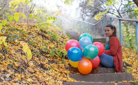 Meditative girl with her balloonsの写真素材