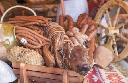 Roast pig and different sorts of meatの写真素材