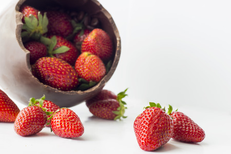 easter chocolate egg and strawberry on a light backgroundの写真素材