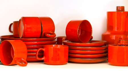 set of red ceramic cups isolated over whiteの写真素材