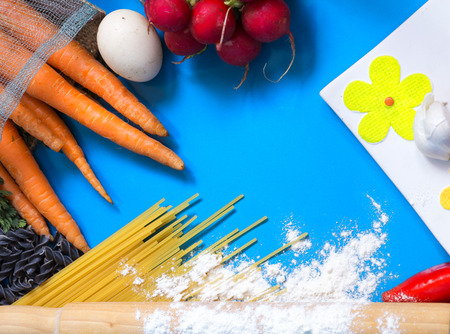 Ingredients for pasta: spaghetti, vegetables and spices isolated. top viewの写真素材