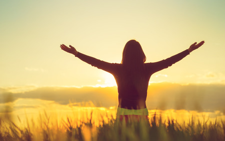 Woman feeling free in a beautiful natural setting.