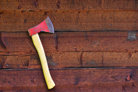 red axe on the wood wallの写真素材