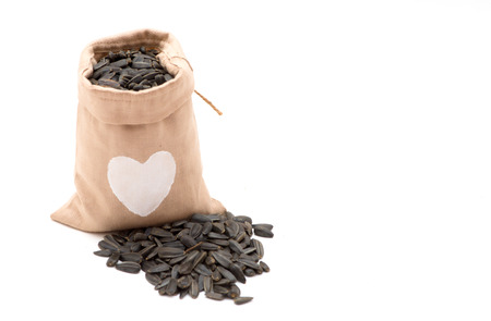 Black sunflower seeds in a bagの写真素材