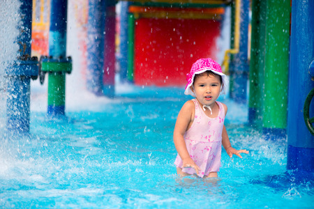 little girl  afraid of water in aqua parkの写真素材