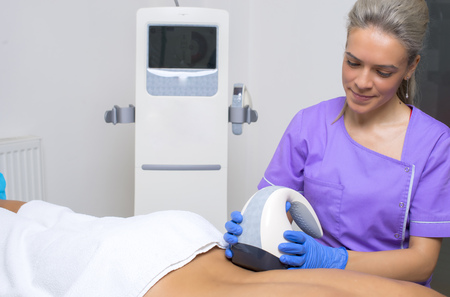 beauty treatment of a young woman in specialized clinicの写真素材