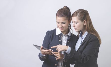 Two business partners, looking at tabletの写真素材