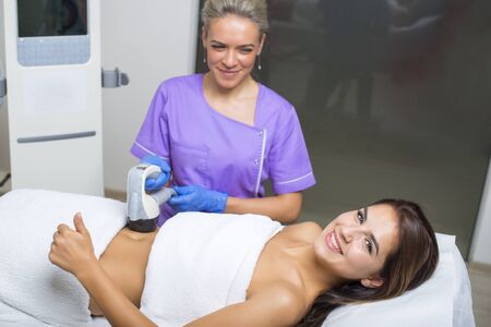 beauty treatment of a young woman in specialized clinicの写真素材