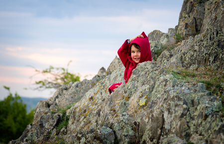 Little girl with Red Riding Hood costume in the natureの写真素材
