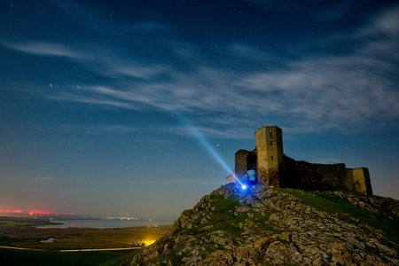 Old castle on hill in the nightのeditorial素材