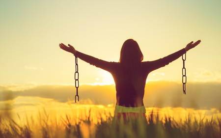 Woman feeling free in a beautiful natural setting.の写真素材