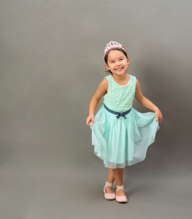 Full length of little fashion girl in studioの写真素材