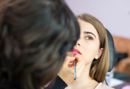 young woman at salon for a make upの写真素材