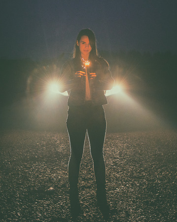 young woman who lights fireworks at home