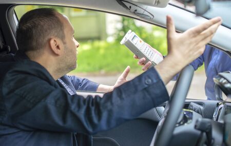 Driver due to being subject to test for alcohol content with use of breath analyzerの写真素材