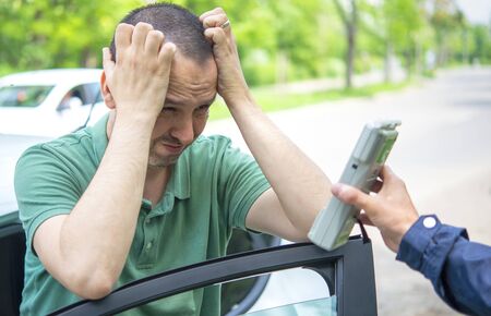 Driver due to being subject to test for alcohol content with use of breath analyzerの写真素材