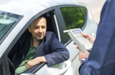 Driver due to being subject to test for alcohol content with use of breath analyzerの写真素材